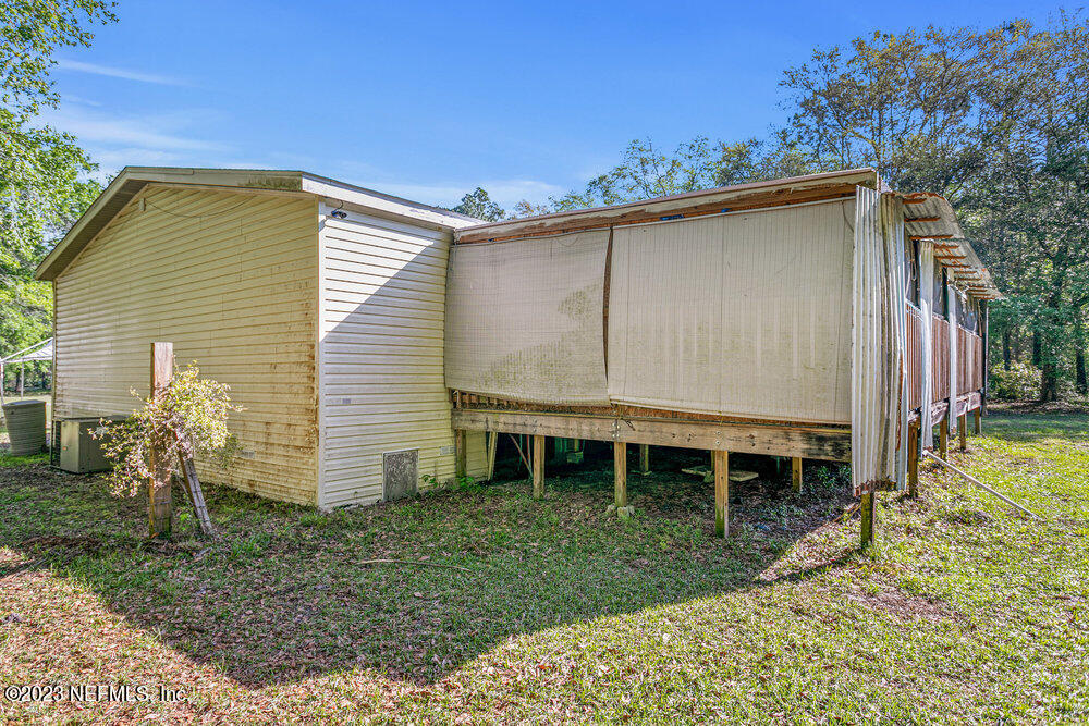 18066 Wells Road Jacksonville, FL 32234 - Photo 38 of 50 a house view with a backyard space
