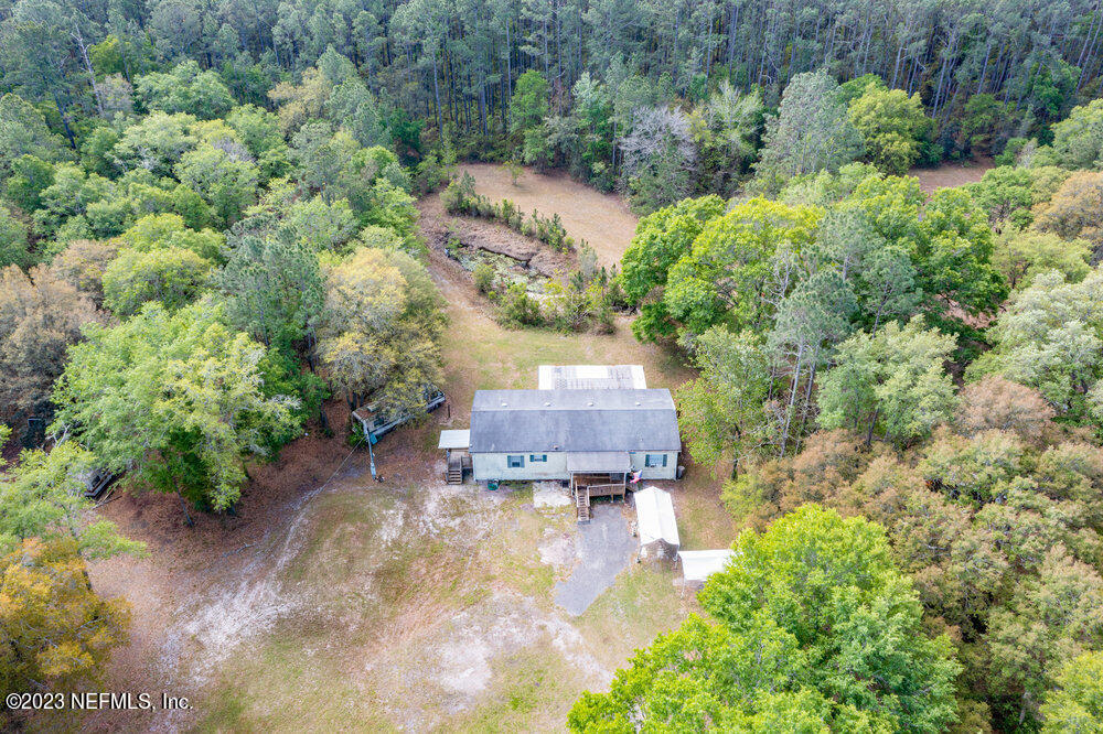 18066 Wells Road Jacksonville, FL 32234 - Photo 45 of 50 an aerial view of a house with a yard