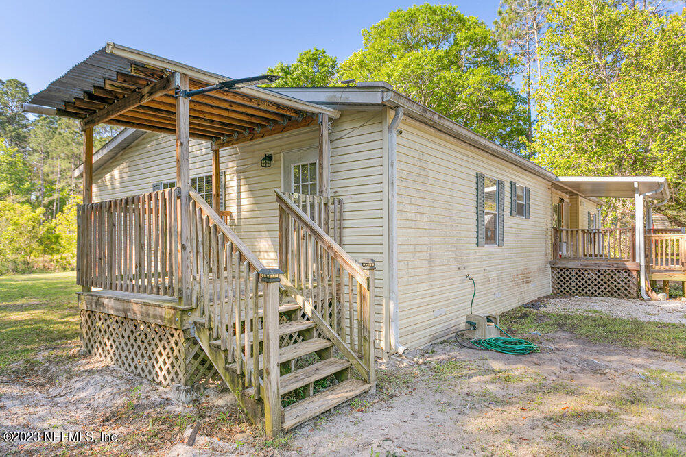 18066 Wells Road Jacksonville, FL 32234 - Photo 8 of 50 a view of a house with wooden fence