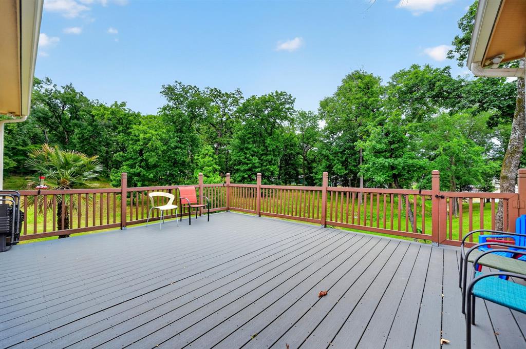 5230 Esquire Estates Road Mabank, TX 75156 - Photo 32 of 39 Spacious outdoor deck with a gray wood-finish surface and a perimeter railing