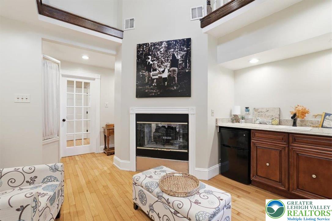 3585 Fairyland Road Lehighton, PA 18235 - Photo 34 of 57 a spacious bedroom with a bed and a fireplace