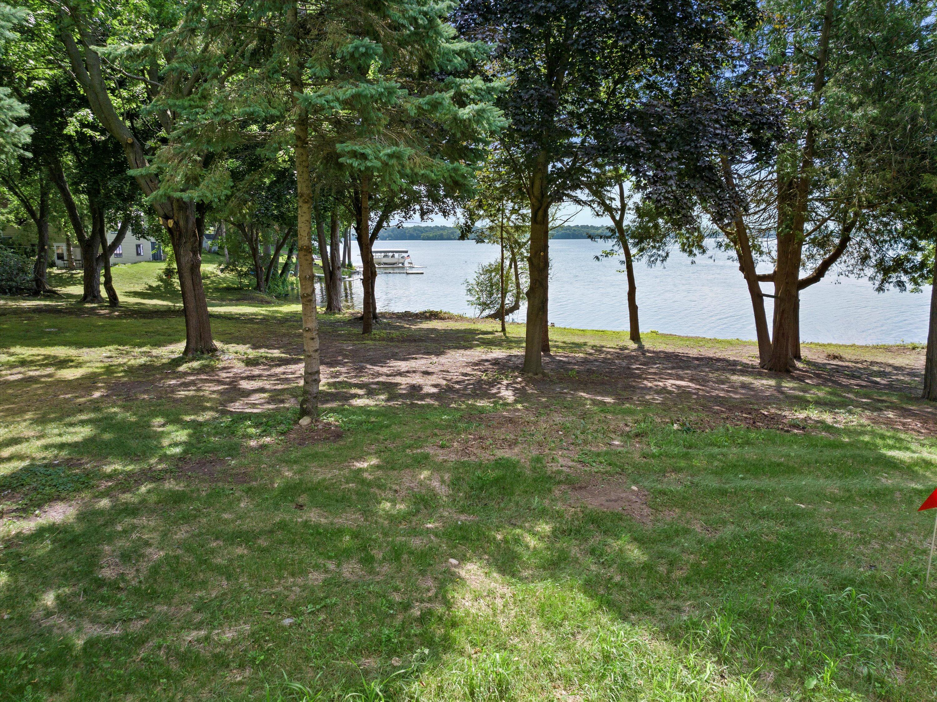 W343N6205 South Bayview Road, Unit LT2 Oconomowoc, WI 53066 - Photo 5 of 14 Set on the original Breezy Point the property offers spectacula views.