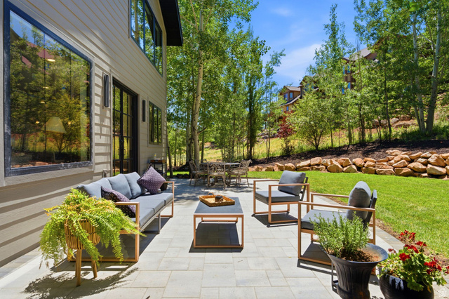 3027 Homestead Road Park City, UT 84098 - Photo 55 of 62 Expansive paver patio with a stone retaining wall and lush green lawn