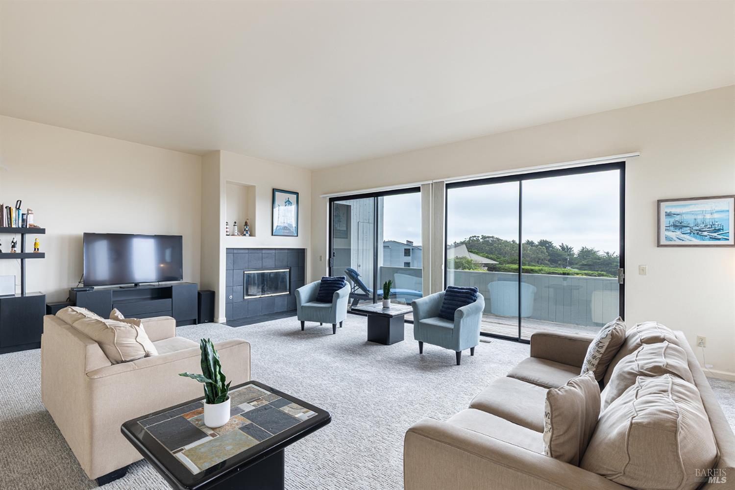 150 Cypress Loop Bodega Bay, CA 94923 - Photo 11 of 62 a living room with furniture flat screen tv and a large window