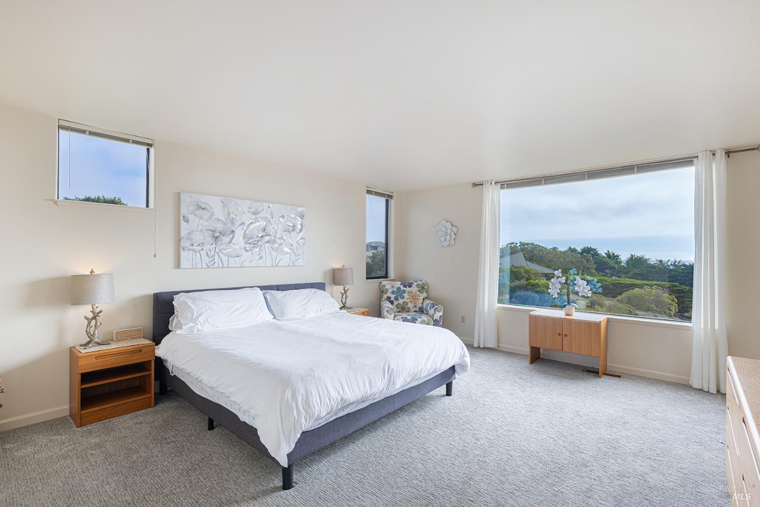 150 Cypress Loop Bodega Bay, CA 94923 - Photo 22 of 62 a bedroom with a bed and a large window