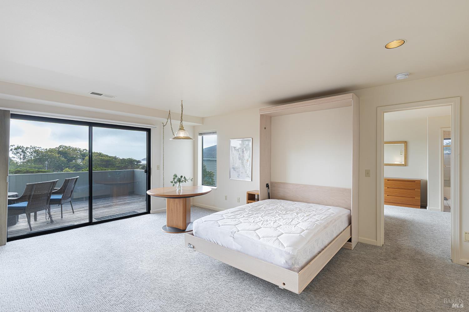 150 Cypress Loop Bodega Bay, CA 94923 - Photo 36 of 62 a bedroom with a balcony a bed and glass door