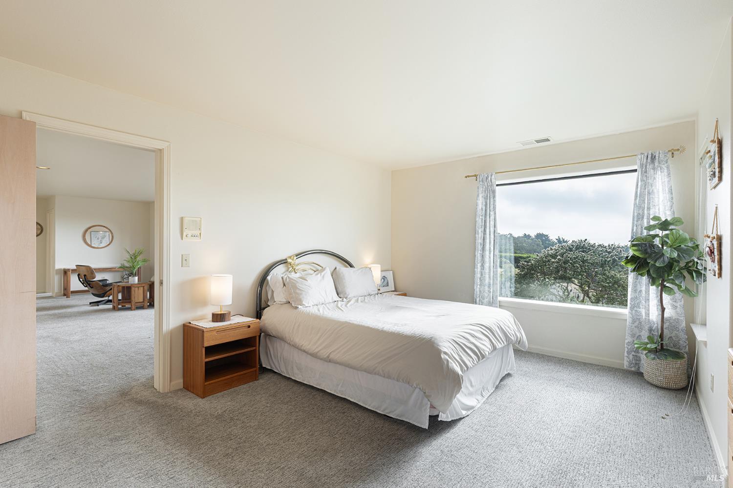 150 Cypress Loop Bodega Bay, CA 94923 - Photo 42 of 62 a spacious bedroom with a bed and a large window