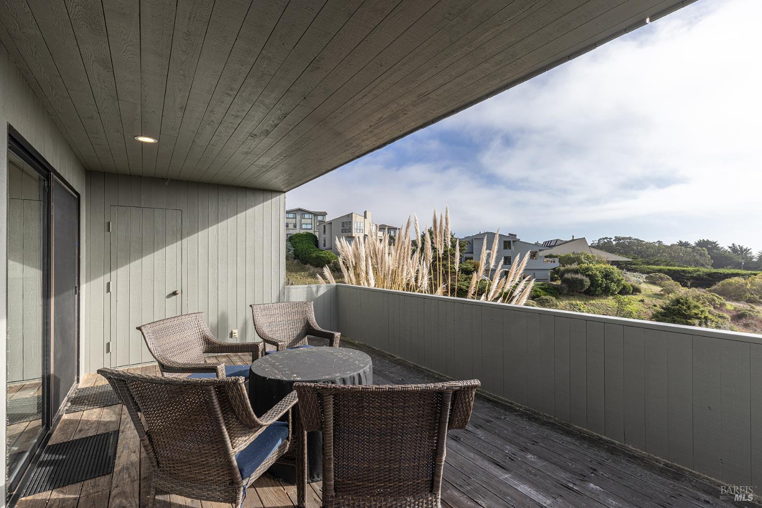 150 Cypress Loop Bodega Bay, CA 94923 - Photo 48 of 62 a view of a balcony dining table and chairs