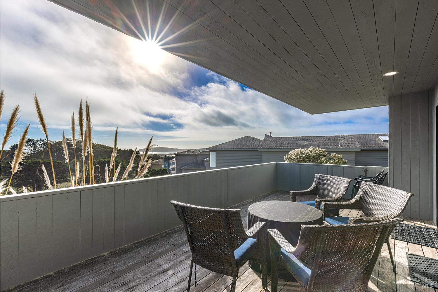 150 Cypress Loop Bodega Bay, CA 94923 - Photo 9 of 62 a view of a dining room with furniture and wooden floor