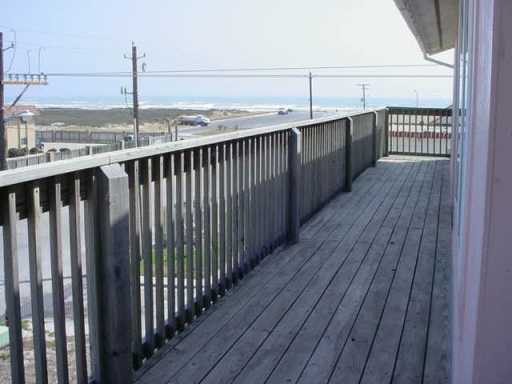 15002 Leeward Drive, Unit 5302 Corpus Christi, TX 78418 - Photo 3 of 3 a view of a balcony with wooden floor