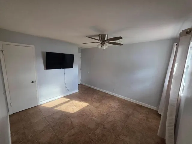 a view of a livingroom with a flat screen tv