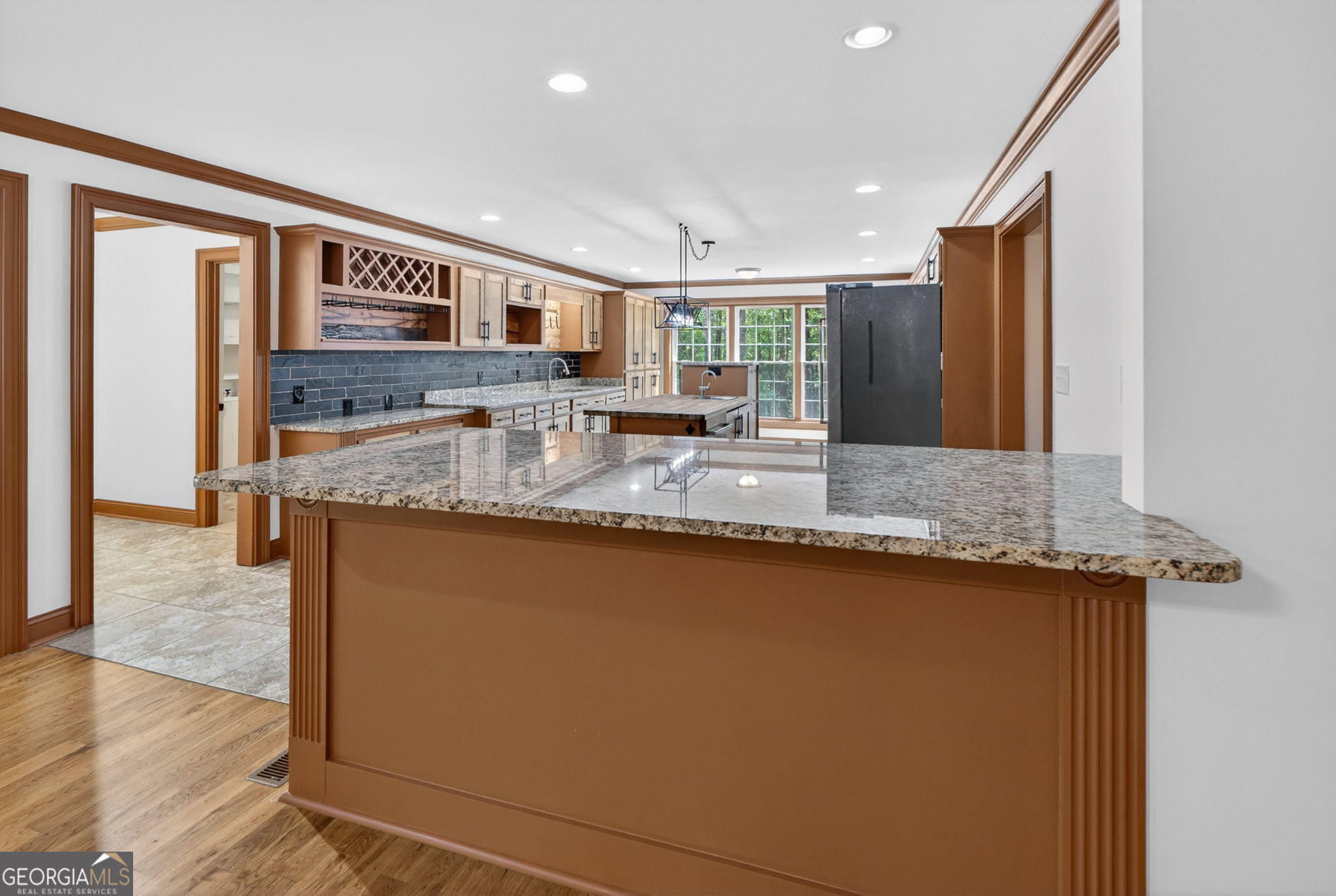 916 Highway 36 Barnesville, GA 30204 - Photo 20 of 81 a large kitchen with granite countertop a sink and cabinets