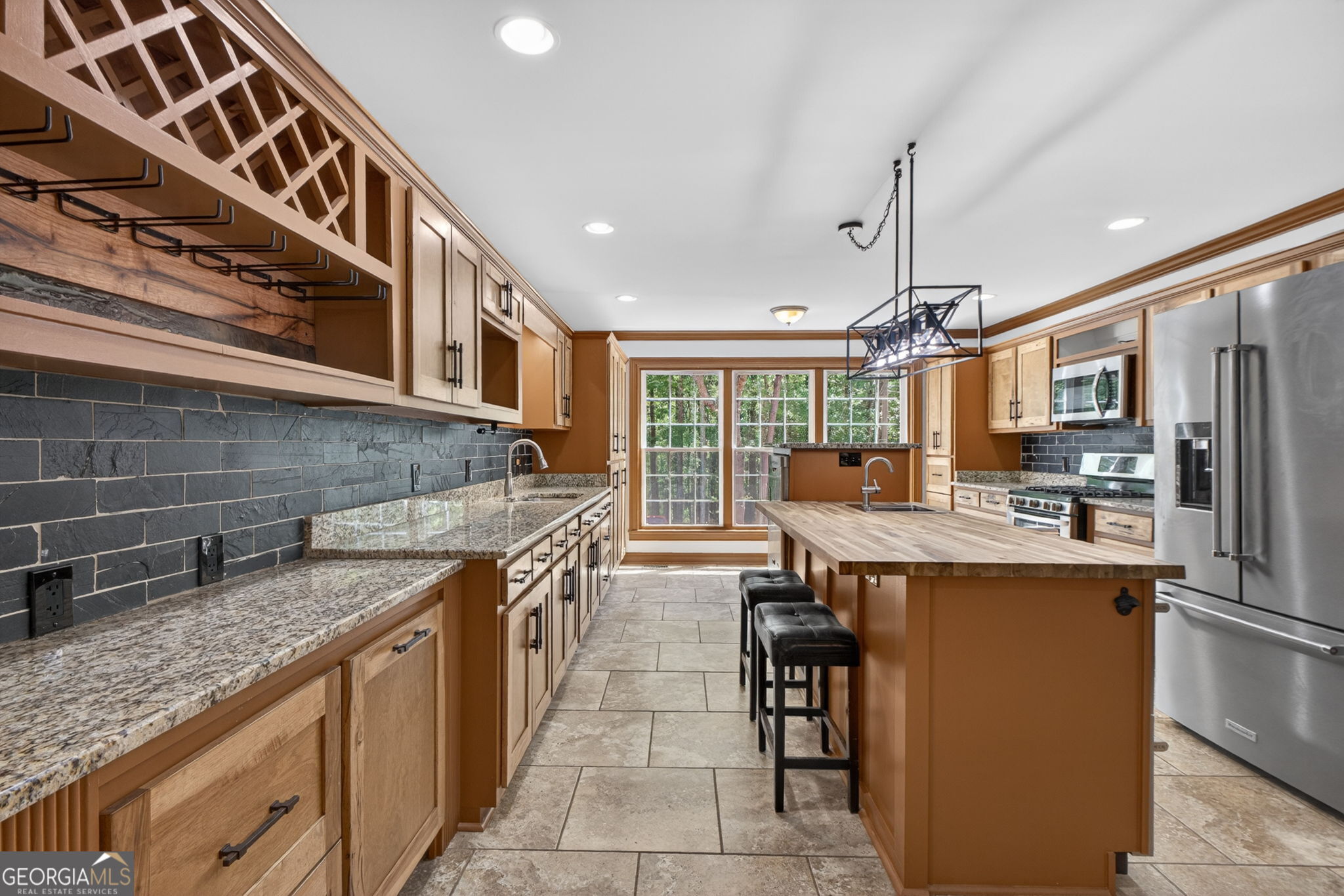 916 Highway 36 Barnesville, GA 30204 - Photo 21 of 81 a kitchen with stainless steel appliances granite countertop a sink and cabinets