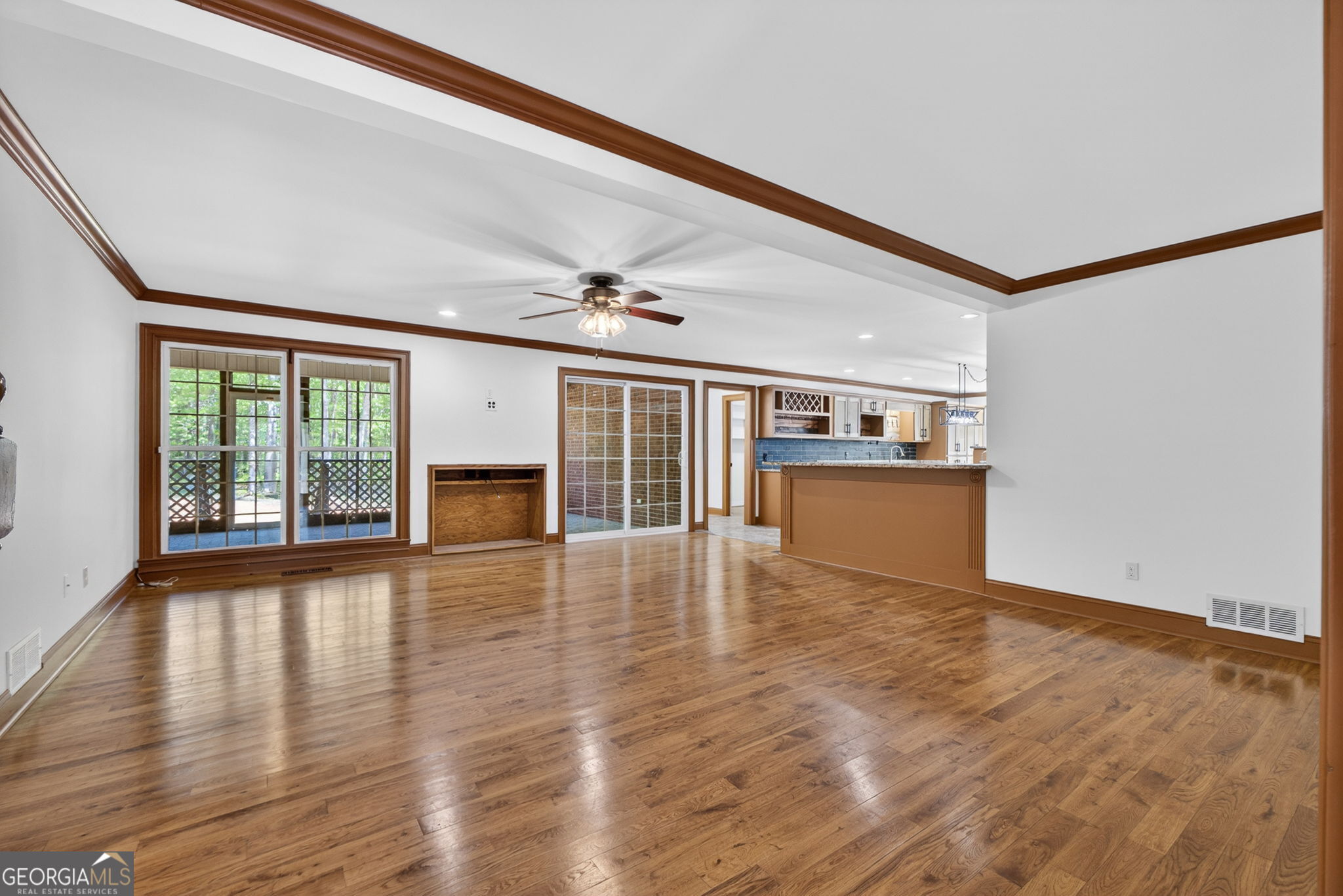 916 Highway 36 Barnesville, GA 30204 - Photo 28 of 81 a view of an empty room with wooden floor and a window