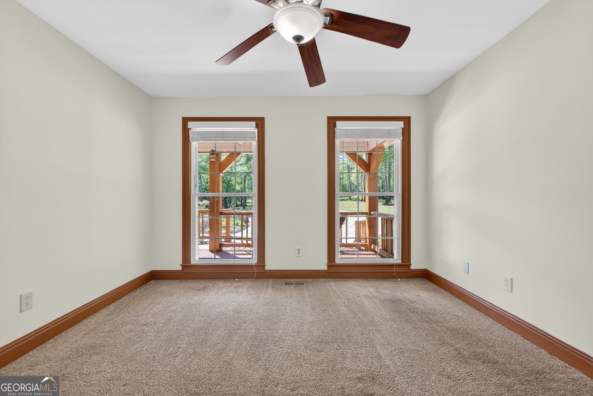916 Highway 36 Barnesville, GA 30204 - Photo 34 of 81 an empty room with windows and ceiling fan