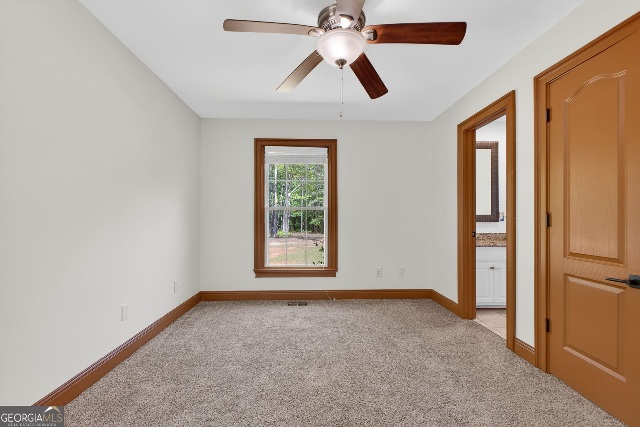 916 Highway 36 Barnesville, GA 30204 - Photo 42 of 81 an empty room with closet and a chandelier fan