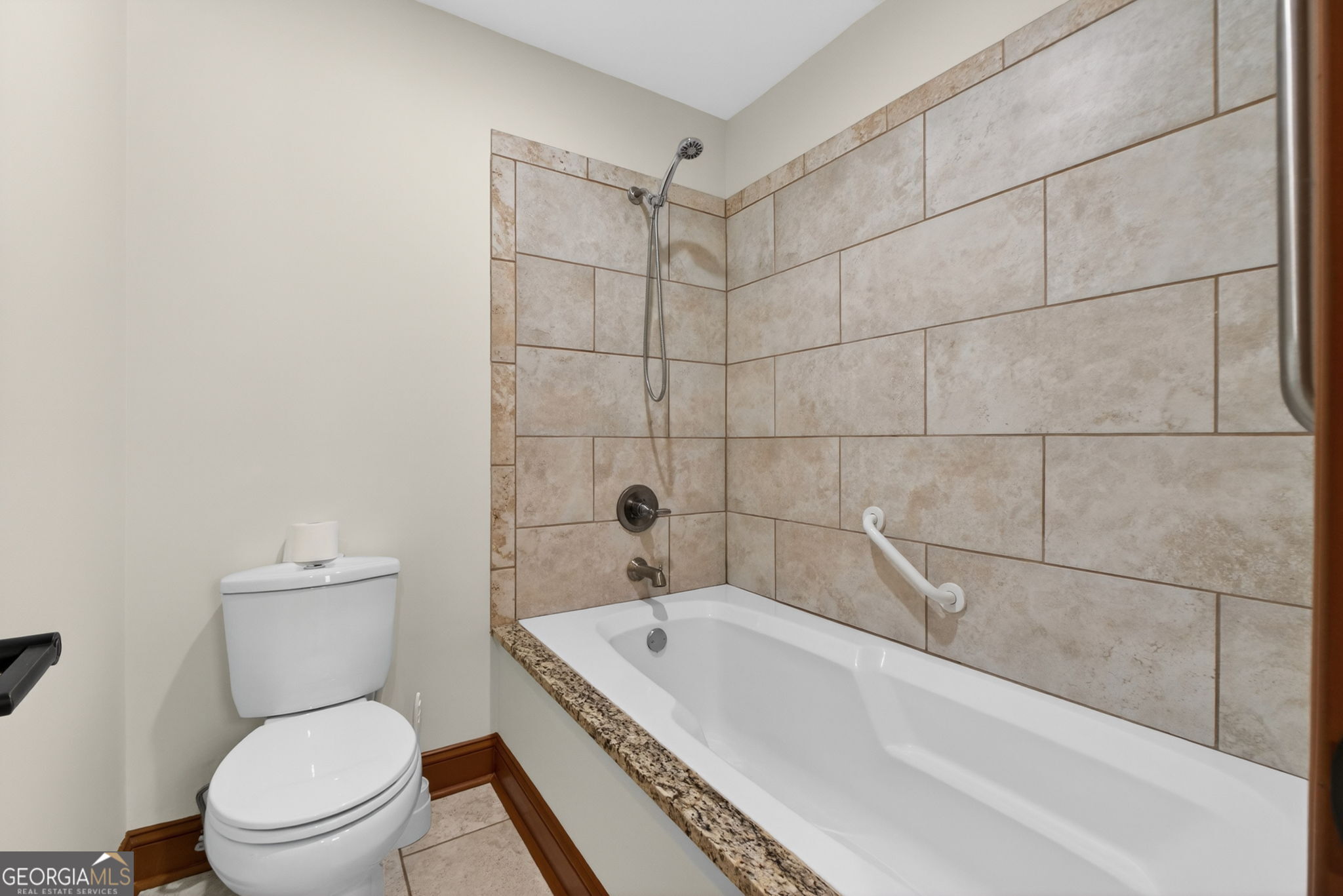 916 Highway 36 Barnesville, GA 30204 - Photo 44 of 81 a bathroom with a toilet and a bathtub