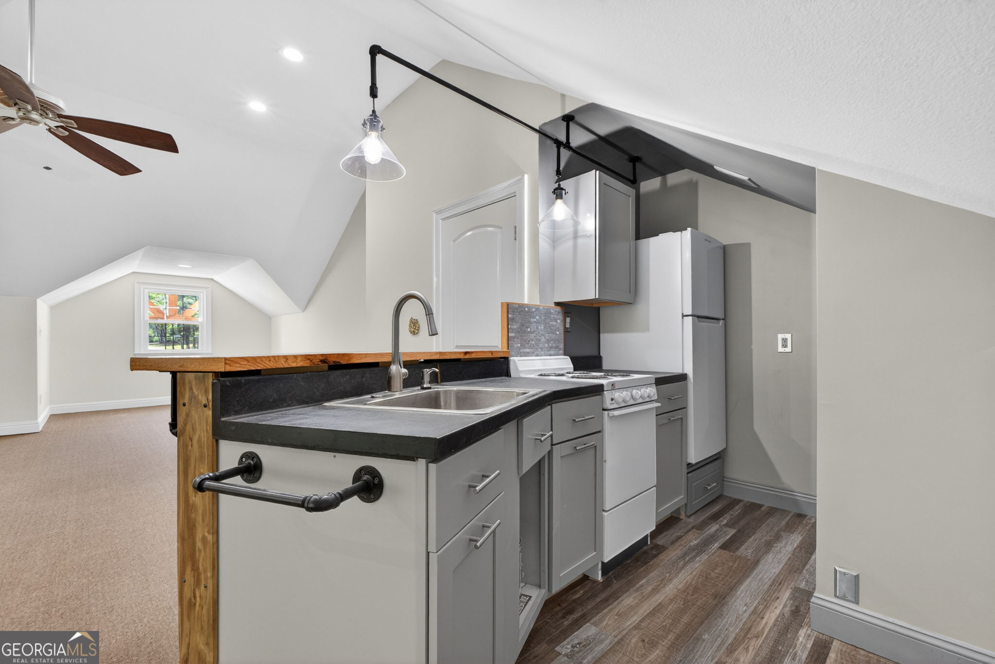 916 Highway 36 Barnesville, GA 30204 - Photo 53 of 81 a kitchen with a sink a refrigerator and a stove