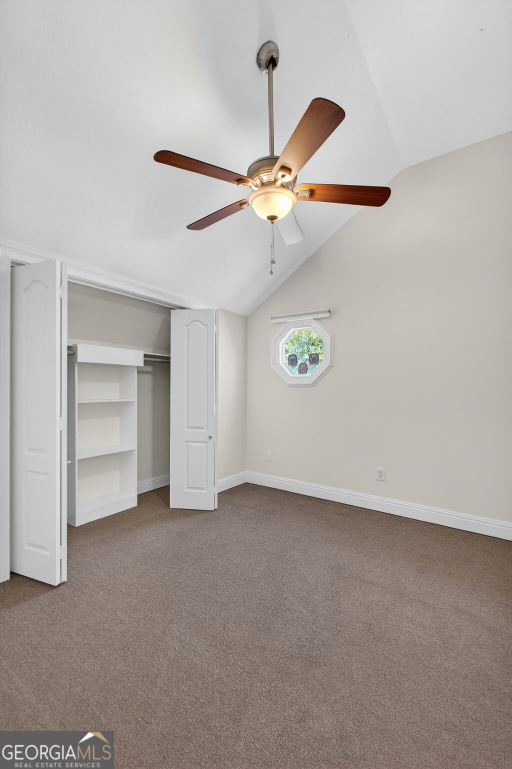 916 Highway 36 Barnesville, GA 30204 - Photo 56 of 81 a view of an empty room with a ceiling fan and a window