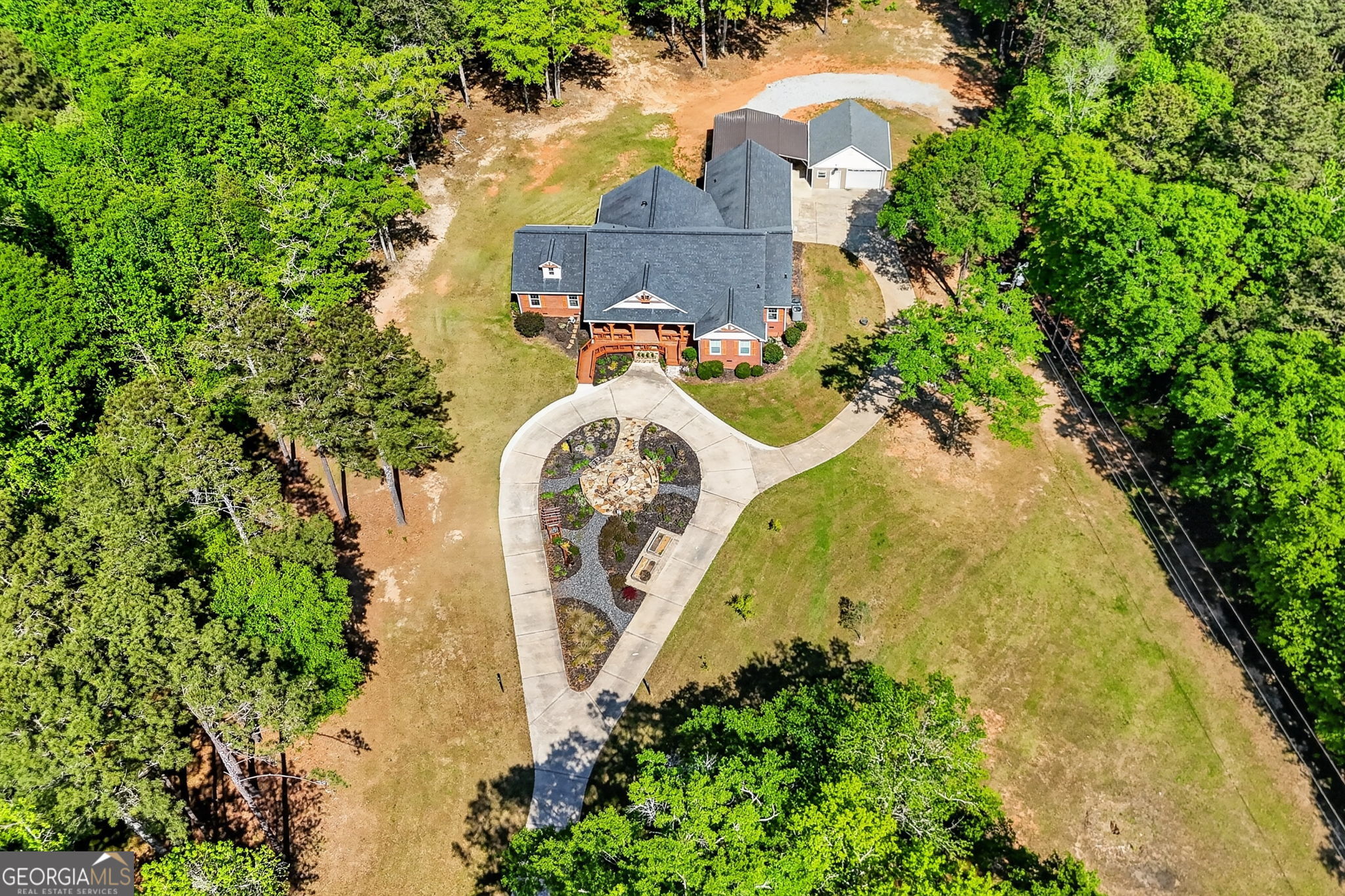 916 Highway 36 Barnesville, GA 30204 - Photo 70 of 81 an aerial view of a house with a yard and trees