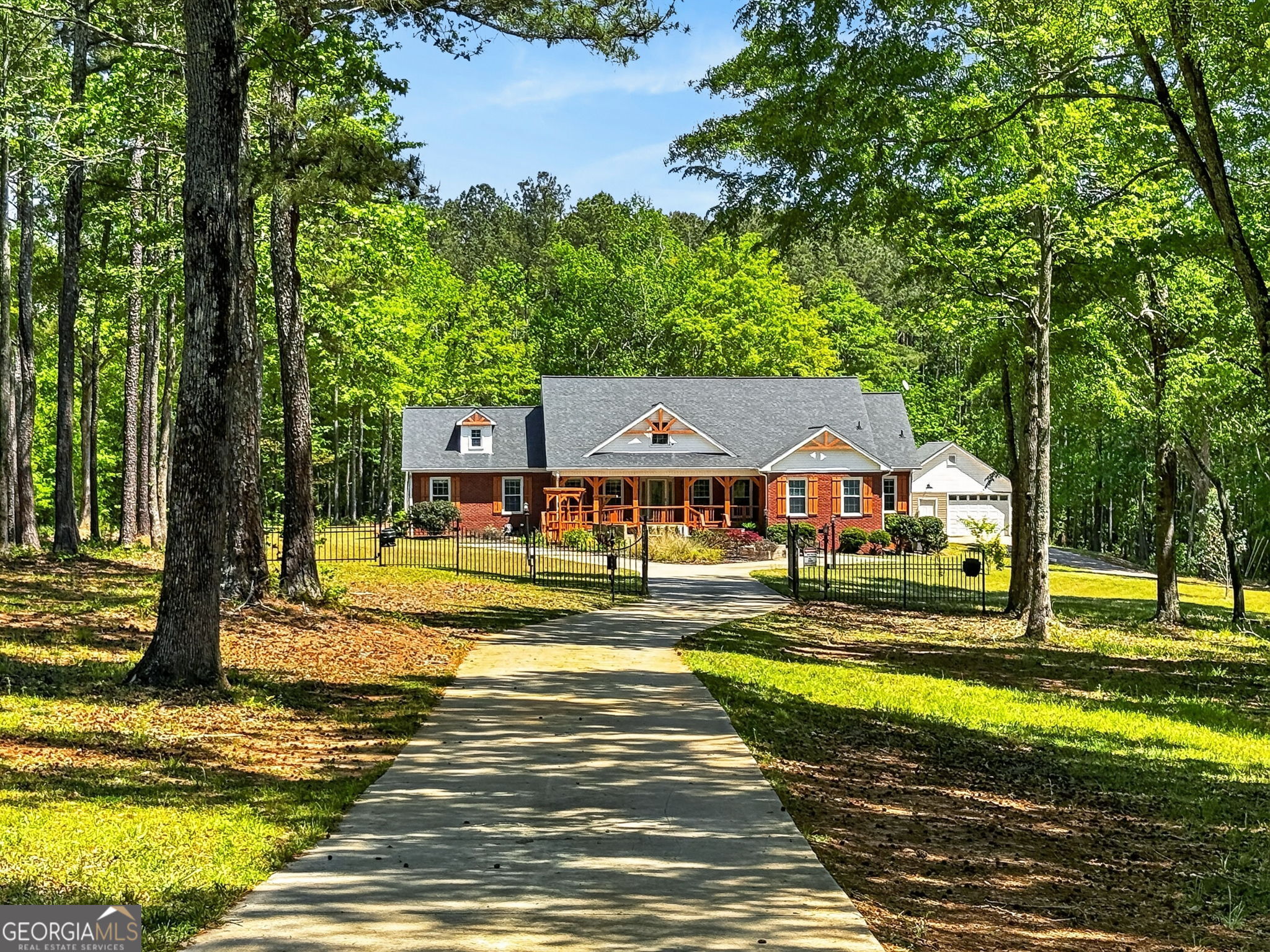 916 Highway 36 Barnesville, GA 30204 - Photo 76 of 81 a view of a swimming pool with a house in the background
