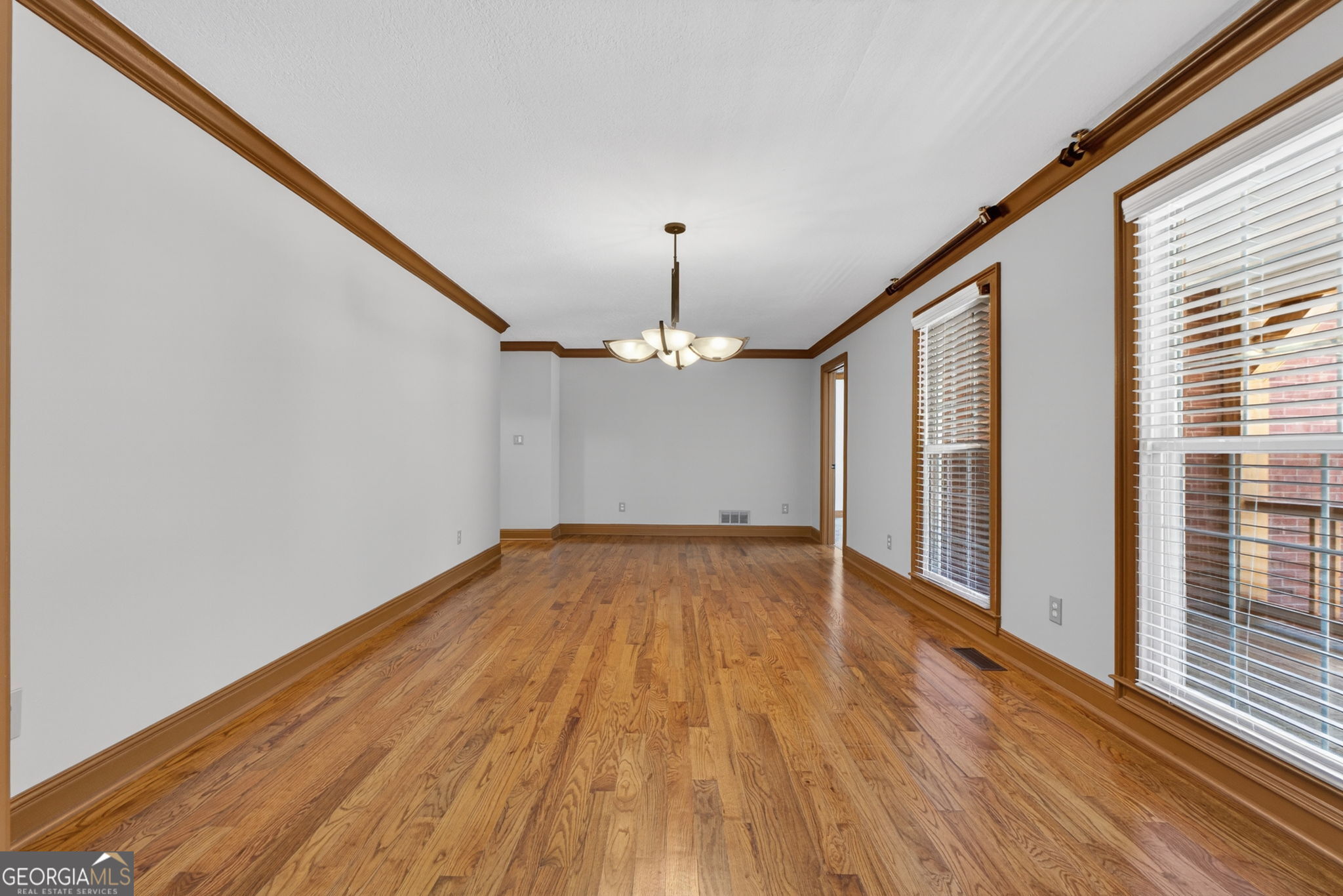 916 Highway 36 Barnesville, GA 30204 - Photo 8 of 81 a view of empty room with wooden floor and fan
