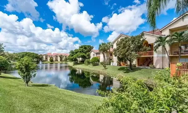 a view of a lake with a house in the background