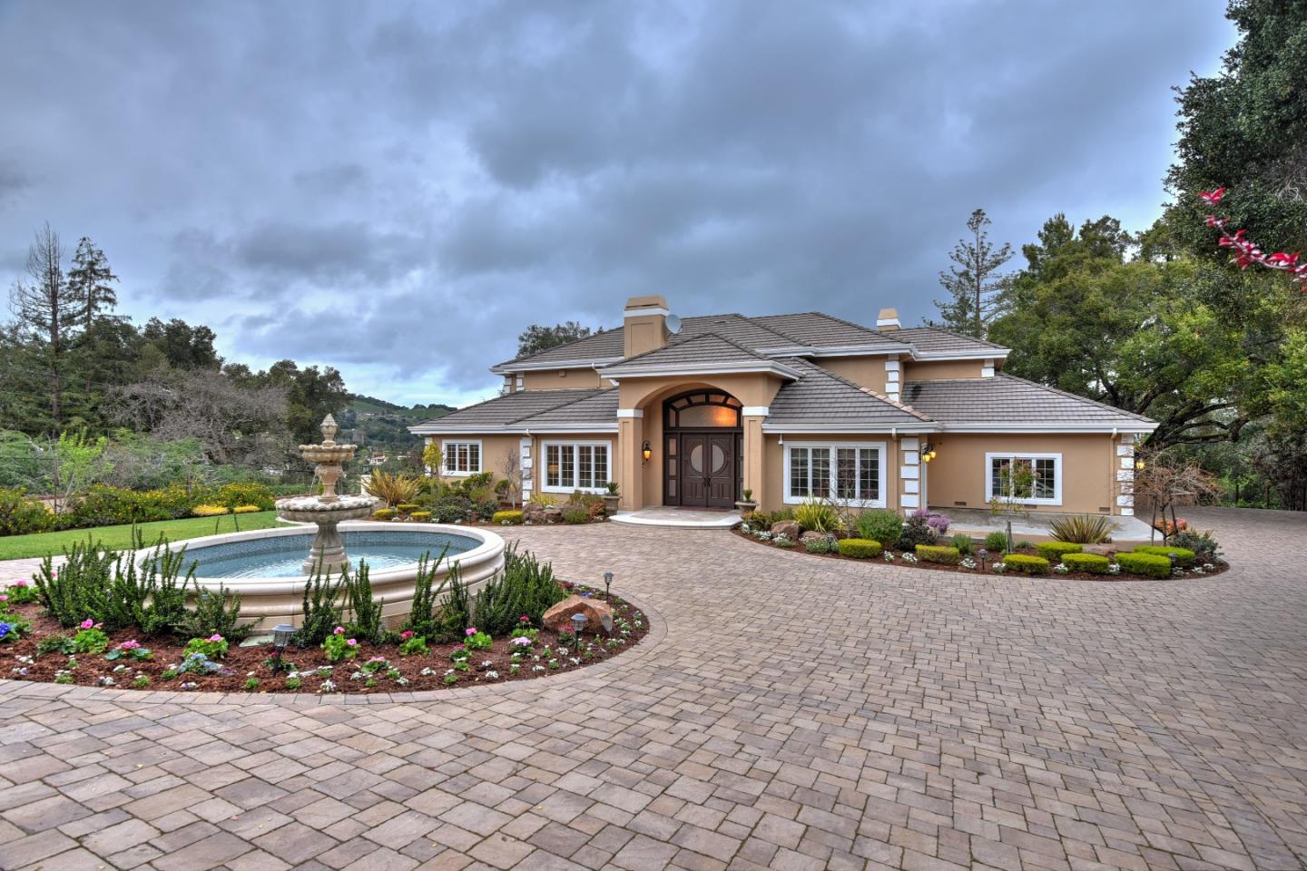 14000 Pike Road Saratoga, CA 95070 - Photo 1 of 48 a front view of a house with a garden and trees