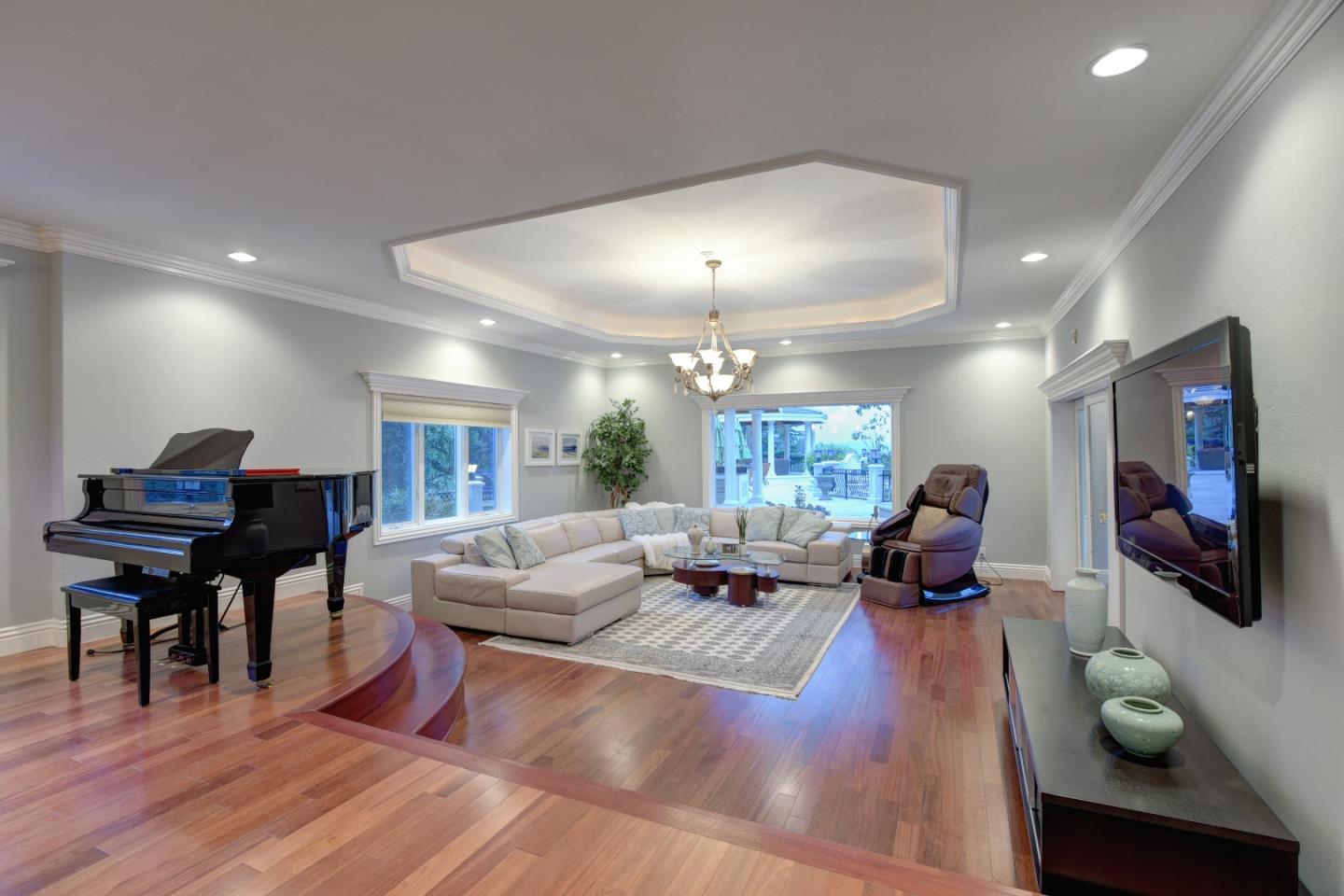 14000 Pike Road Saratoga, CA 95070 - Photo 11 of 48 a living room with furniture and a flat screen tv