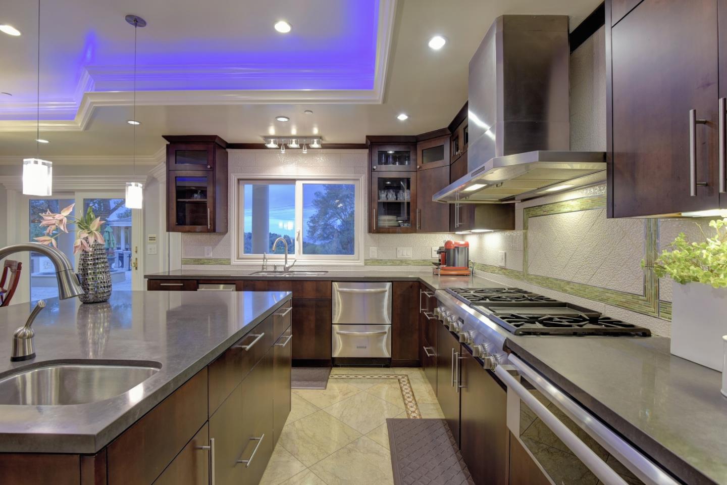 14000 Pike Road Saratoga, CA 95070 - Photo 16 of 48 a kitchen with stainless steel appliances granite countertop a sink stove and cabinets