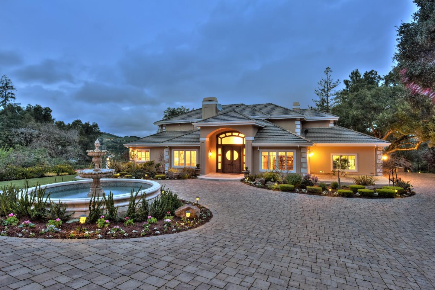 14000 Pike Road Saratoga, CA 95070 - Photo 2 of 48 a front view of a house with a garden