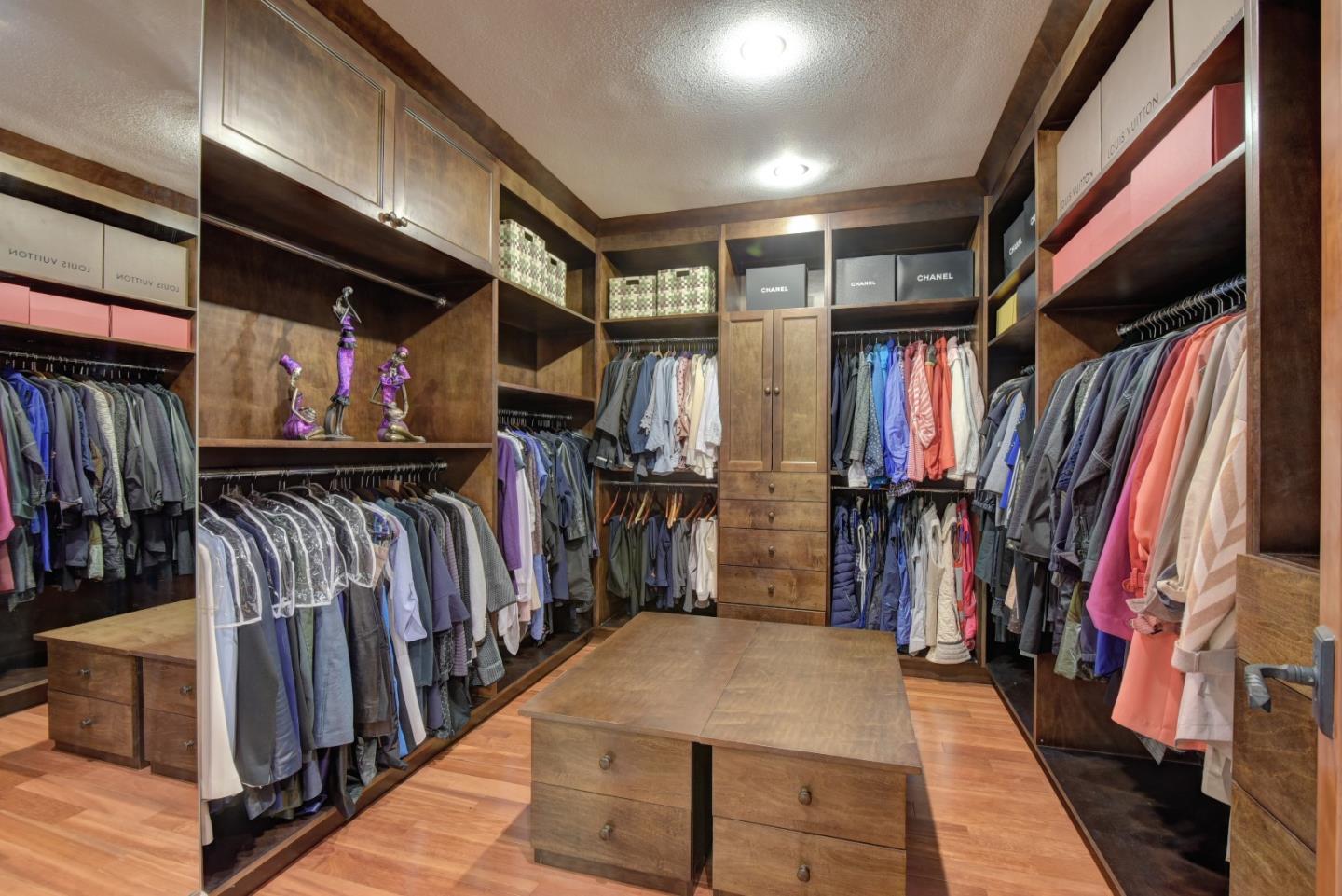 14000 Pike Road Saratoga, CA 95070 - Photo 21 of 48 a view of walk in closet with clothes and shoes