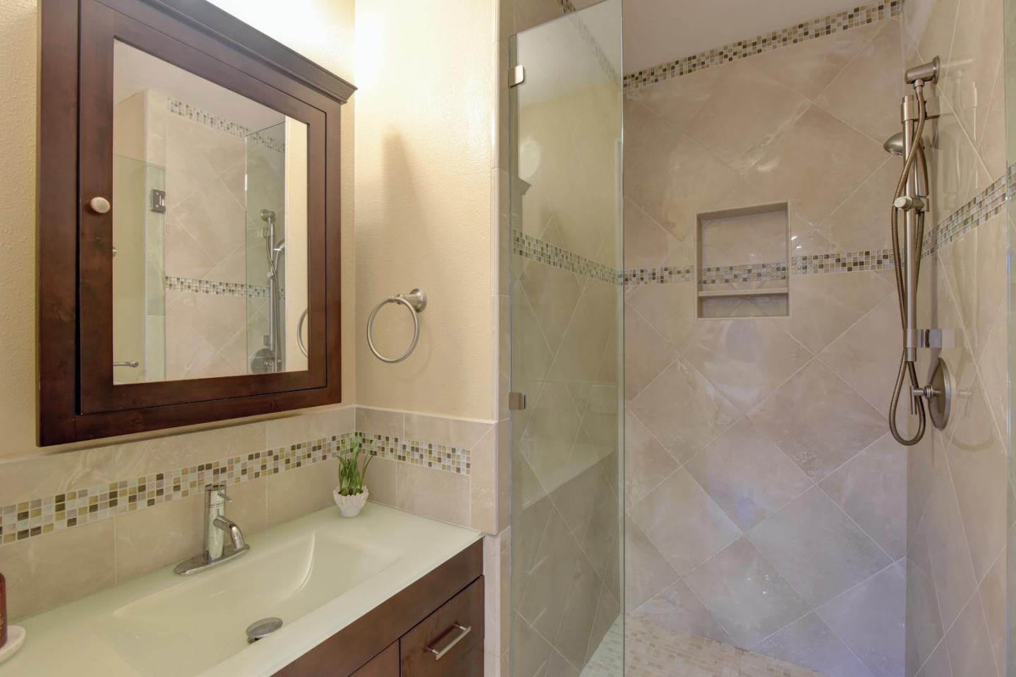 14000 Pike Road Saratoga, CA 95070 - Photo 29 of 48 a bathroom with a shower sink and mirror