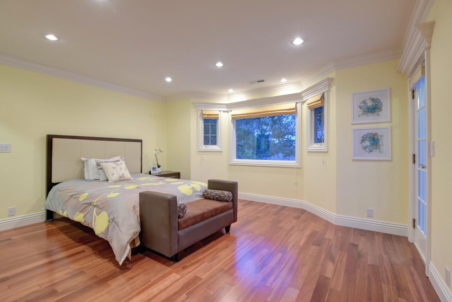 14000 Pike Road Saratoga, CA 95070 - Photo 32 of 48 a large bedroom with a bed and wooden floor