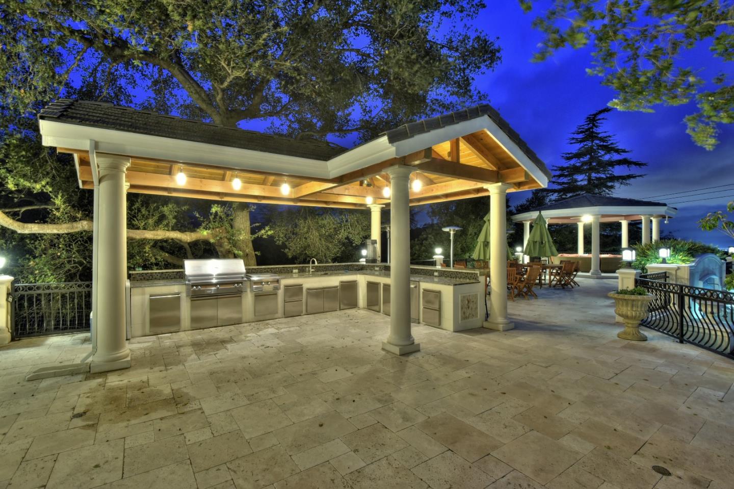 14000 Pike Road Saratoga, CA 95070 - Photo 33 of 48 a view of a patio with table and chairs and potted plants