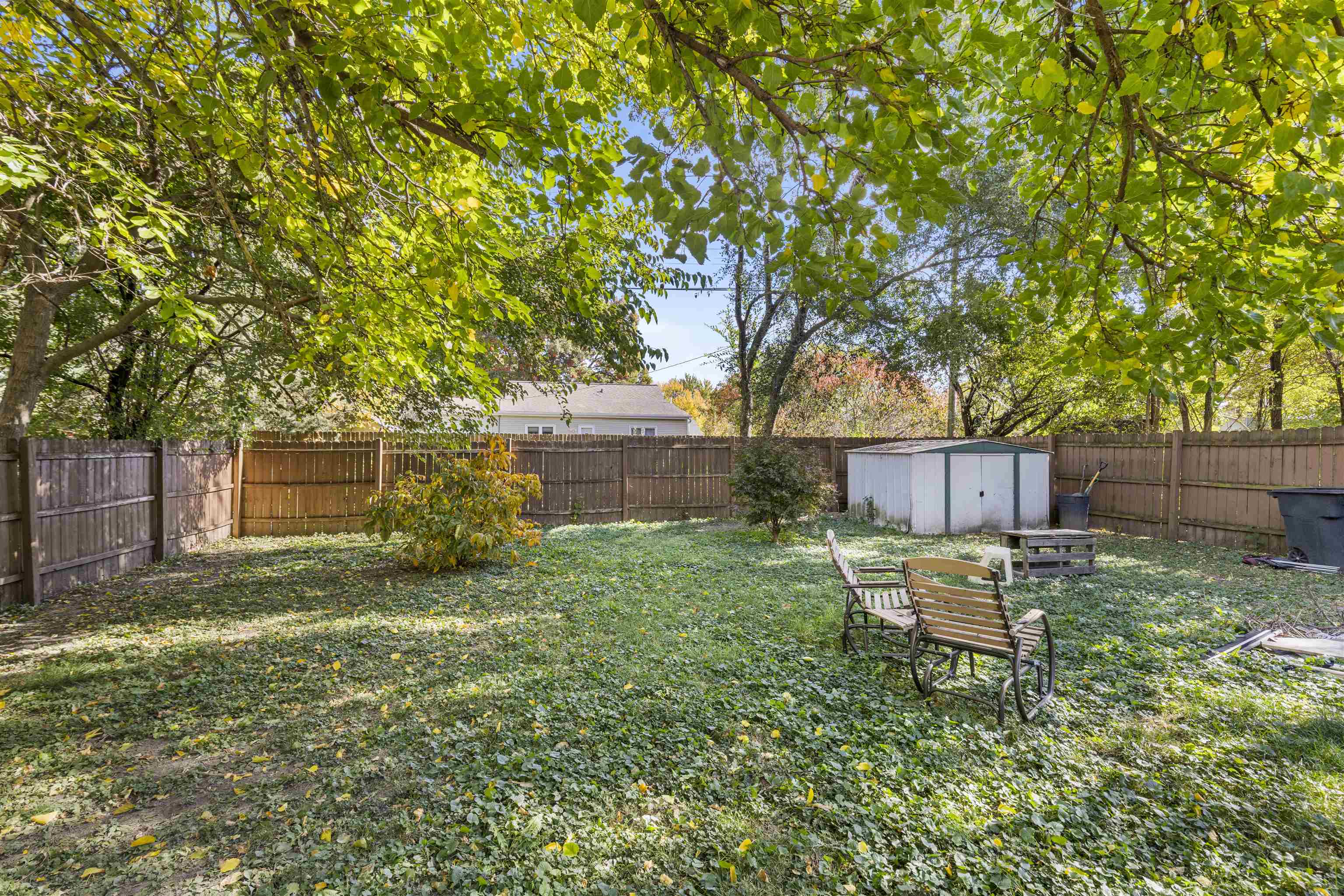 907 Woolf Court Rochelle, IL 61068 - Photo 15 of 15 a backyard of a house with table and chairs