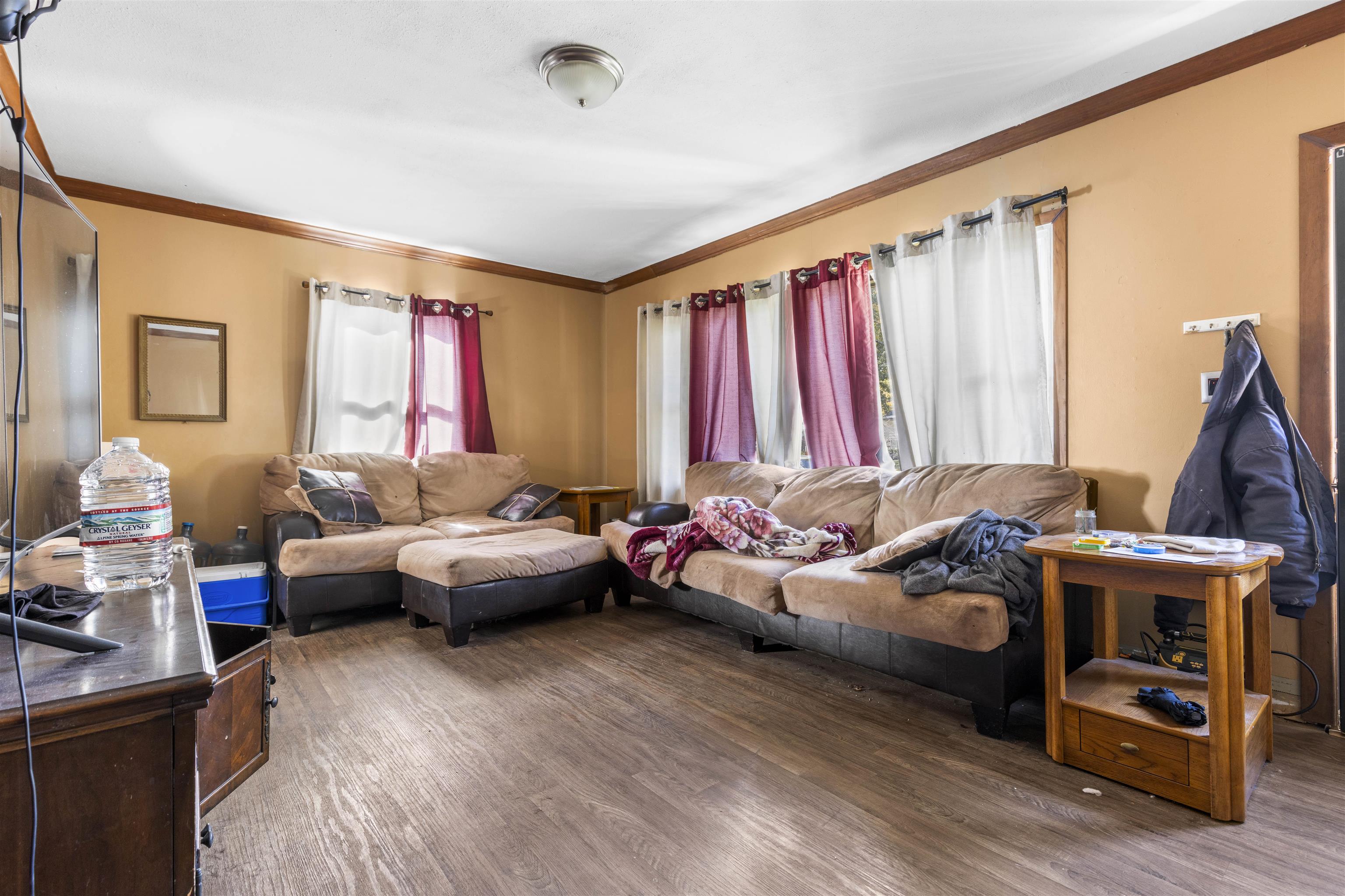 907 Woolf Court Rochelle, IL 61068 - Photo 3 of 15 a living room with furniture and a wooden floor