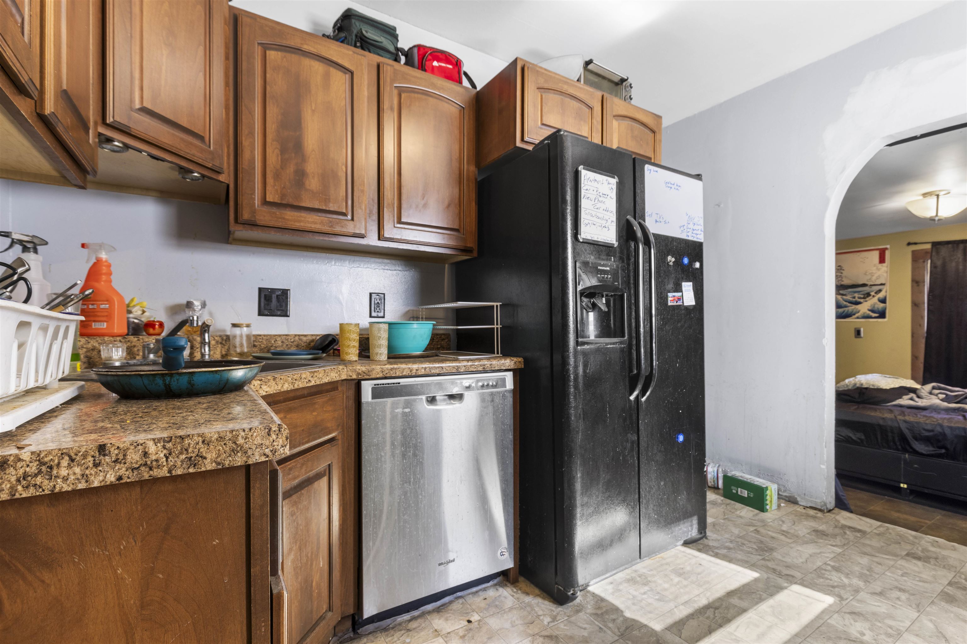907 Woolf Court Rochelle, IL 61068 - Photo 5 of 15 a kitchen with stainless steel appliances granite countertop a refrigerator a stove and a sink