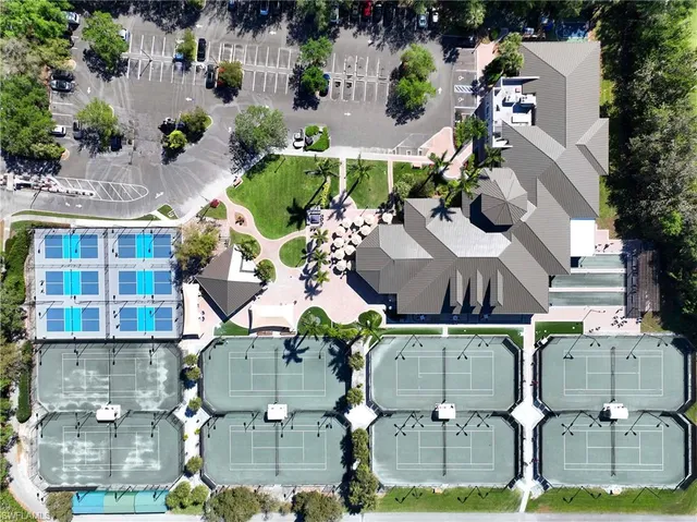 an aerial view of a houses with yard