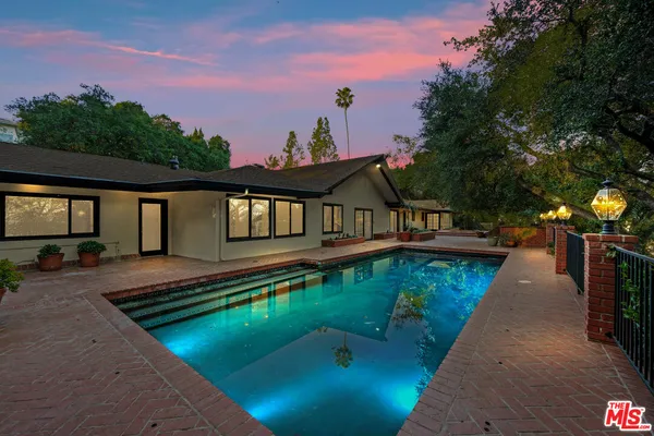 a view of a house with swimming pool