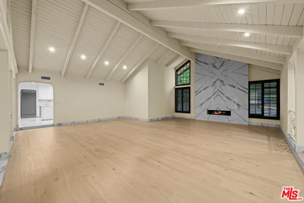 a kitchen with stainless steel appliances granite countertop a sink and cabinets