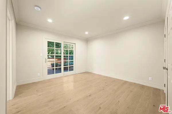 a spacious bathroom with a shower sink and mirror