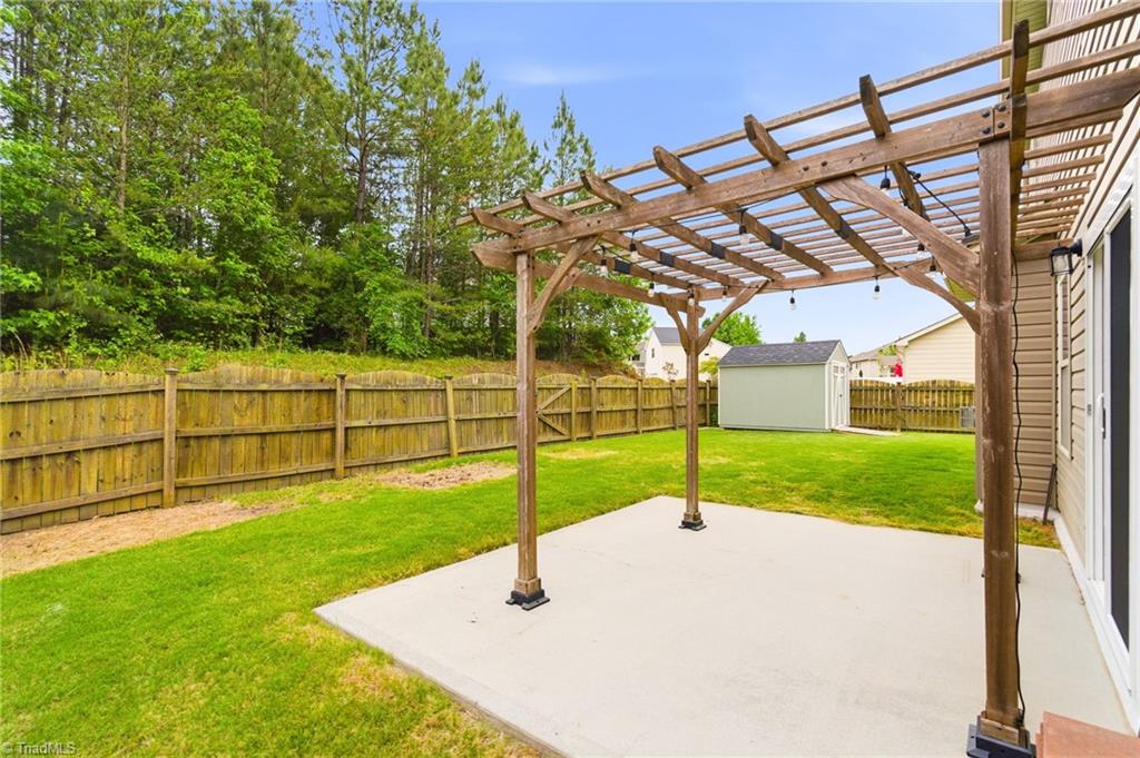 959 Longleaf Pine Place Mebane, NC 27302 - Photo 41 of 47 Fenced backyard and Pergola