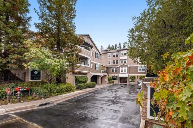 a view of multiple houses with a street