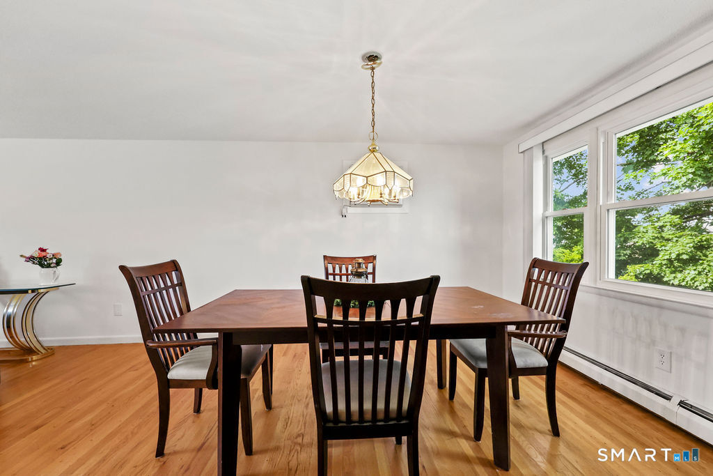 142 Wolcott Hill Road Wethersfield, CT 06109 - Photo 9 of 29 a view of a dining room with furniture window and outside view