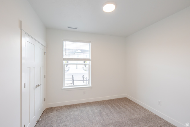 693 West 4500th South, Unit O101 Mapleton, UT 84664 - Photo 7 of 16 Unfurnished room featuring light carpet and baseboards
