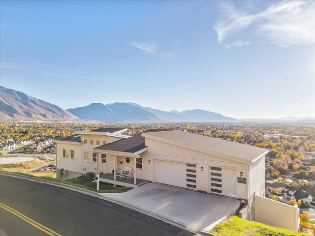 1800 Spring Oaks Drive Springville, UT 84663 - Photo 5 of 68 View of front of house featuring a mountain view, an attached garage, concrete driveway, and a residential view