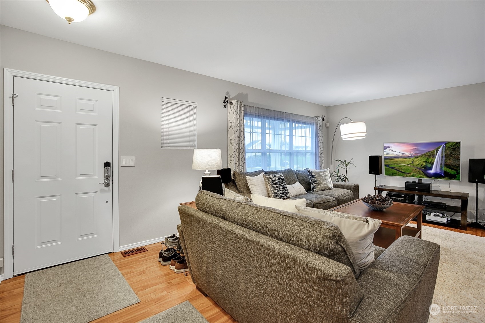 3834 Northeast 5th Place Renton, WA 98056 - Photo 12 of 39 a living room with furniture window and a flat screen tv