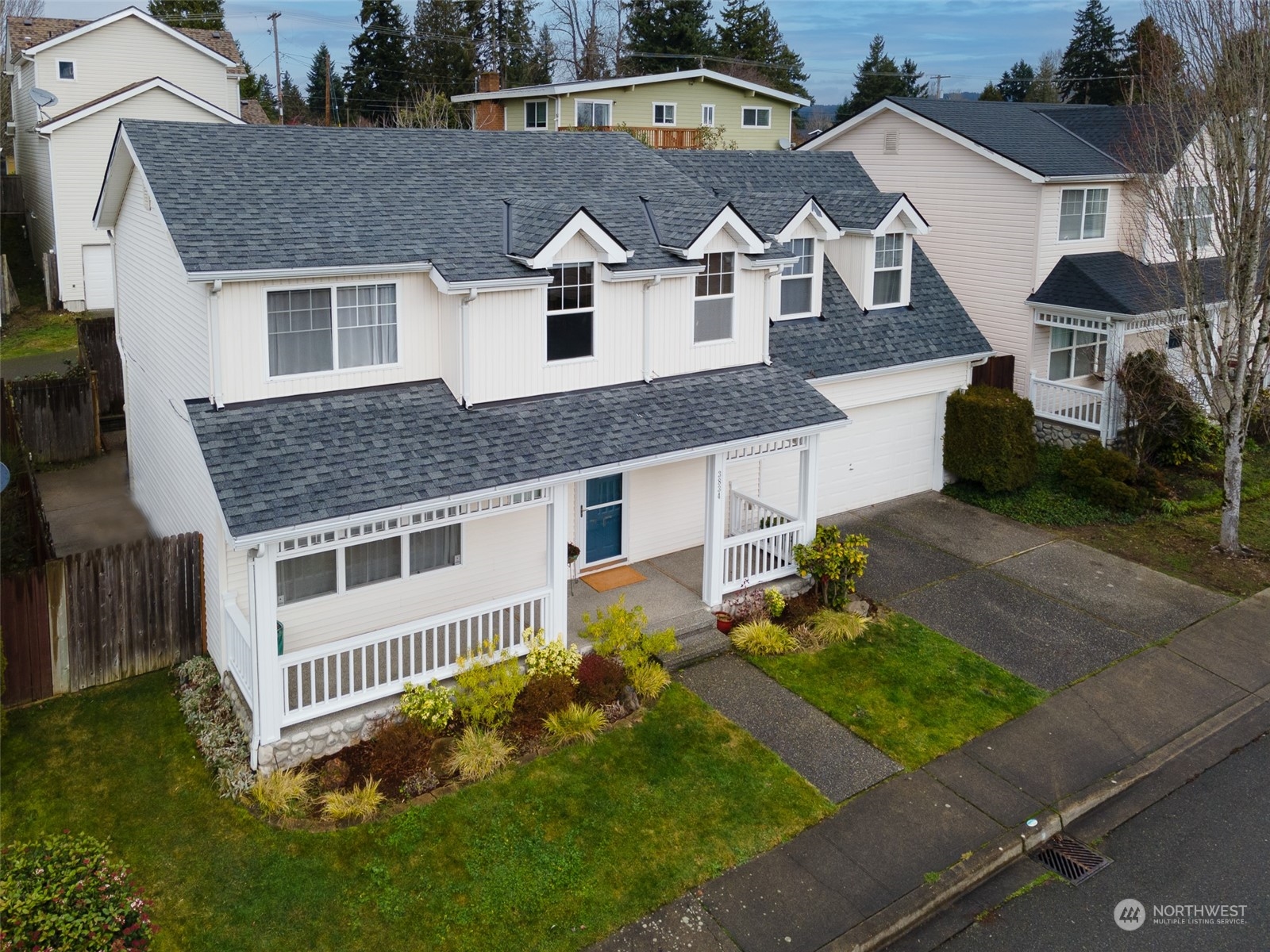 3834 Northeast 5th Place Renton, WA 98056 - Photo 2 of 39 an aerial view of a house with yard and trees
