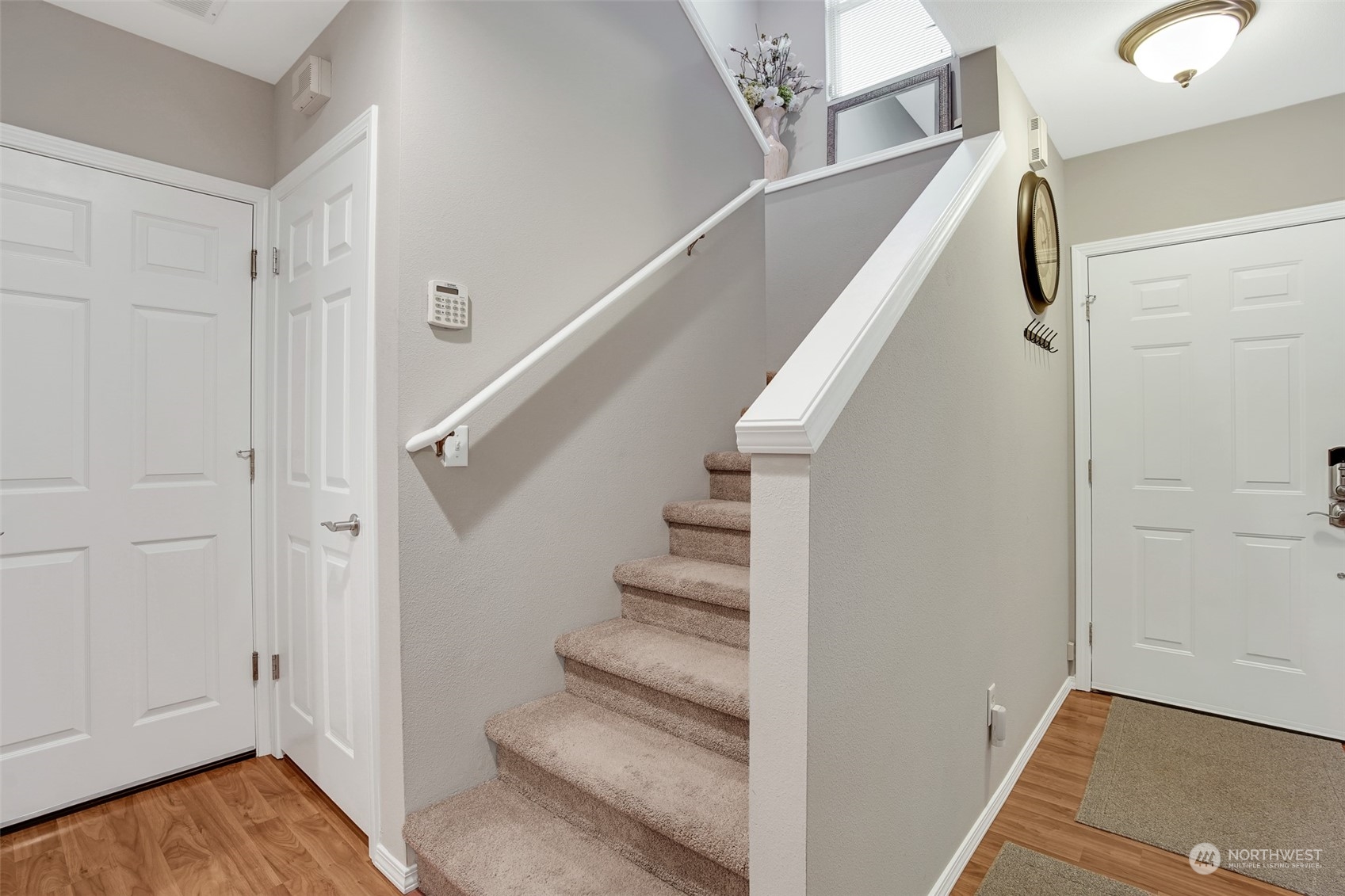 3834 Northeast 5th Place Renton, WA 98056 - Photo 27 of 39 a view of entryway with wooden floor and stairs